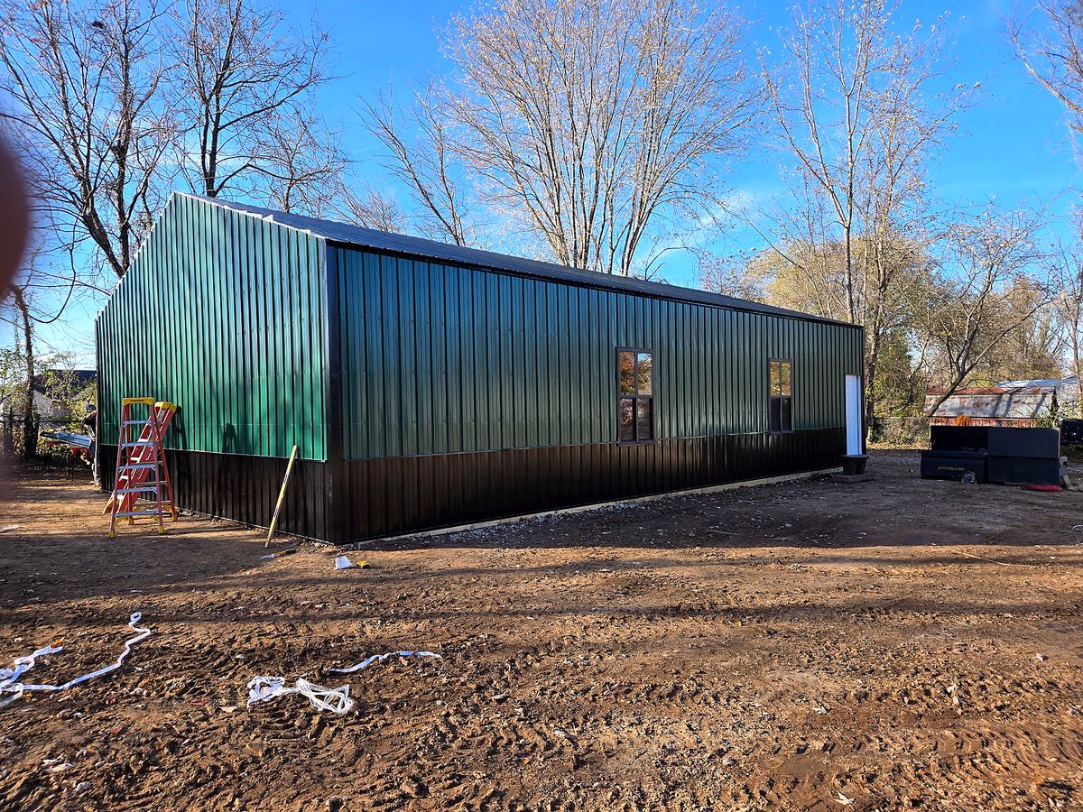 Dark green pole barn exterior
