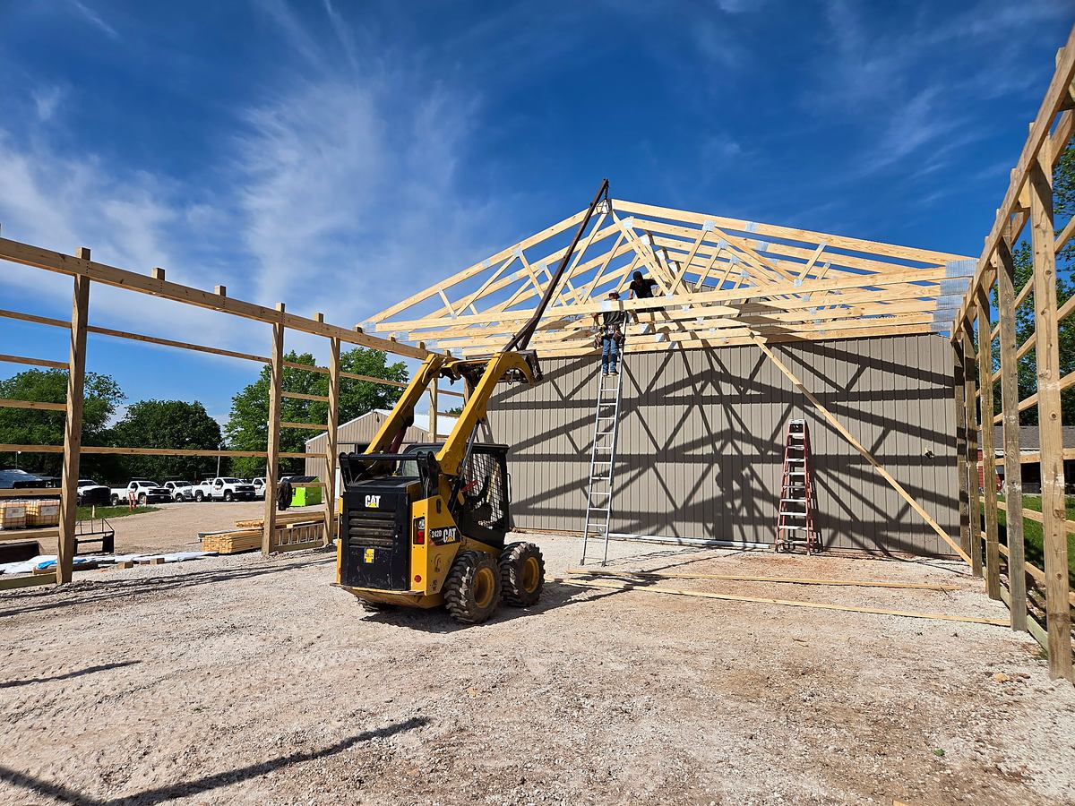Pole barn framing and truss installation in progress